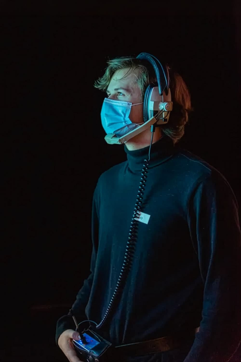 Tibo Van Camp on set, wearing an intercom headset